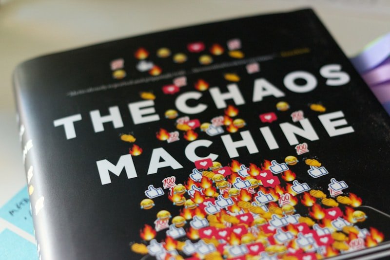 a book about the chaos machine on a table